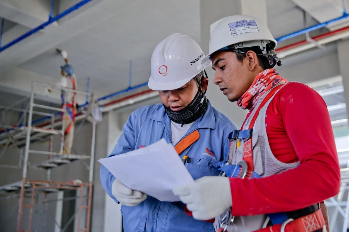 Construction team reviewing plans